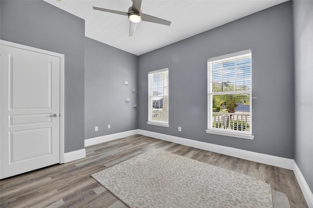 5720 Tortoise Pl, Apollo Beach, FL 33572 - unfurnished room with a ceiling fan and wood finished floors
