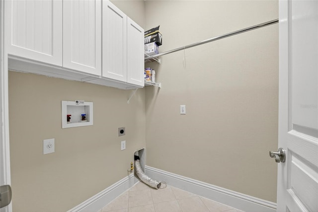 5720 Tortoise Pl, Apollo Beach, FL 33572 - laundry area with electric dryer hookup, hookup for a washing machine, cabinet space, and tile patterned floors