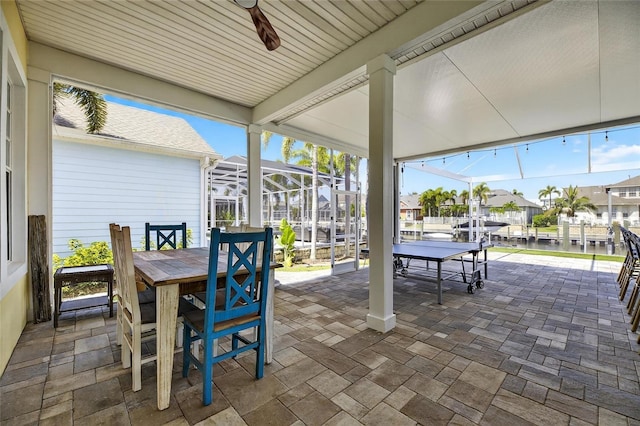 5720 Tortoise Pl, Apollo Beach, FL 33572 - view of patio / terrace with outdoor dining area, ceiling fan, and a residential view