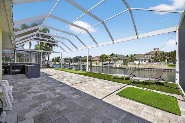 5720 Tortoise Pl, Apollo Beach, FL 33572 - view of patio featuring a hot tub, a water view, a residential view, and glass enclosure