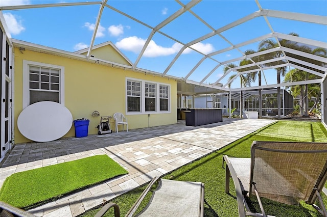 5720 Tortoise Pl, Apollo Beach, FL 33572 - back of property with a jacuzzi, a patio, a lanai, and stucco siding