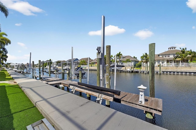 5720 Tortoise Pl, Apollo Beach, FL 33572 - dock featuring boat lift, a water view, and a residential view