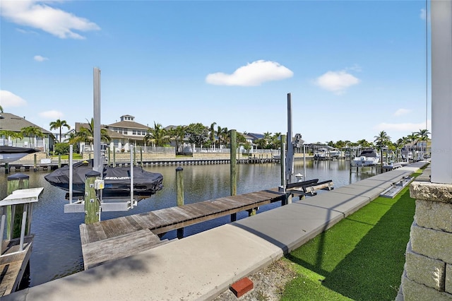 5720 Tortoise Pl, Apollo Beach, FL 33572 - dock featuring boat lift, a water view, and a residential view