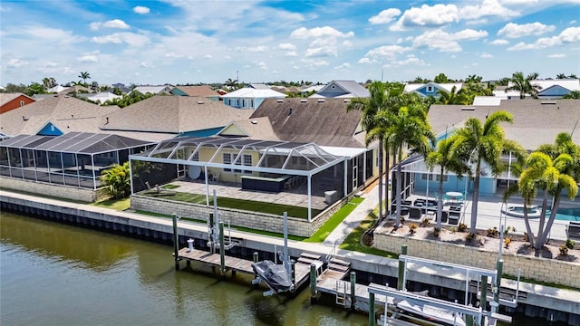 5720 Tortoise Pl, Apollo Beach, FL 33572 - dock with boat lift, a patio area, and a water view