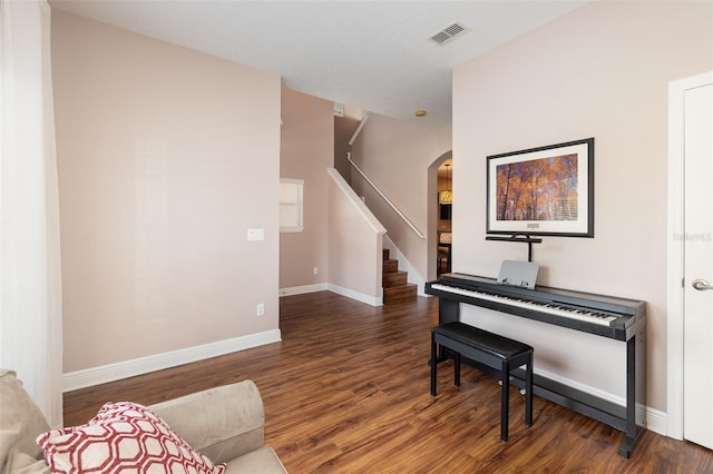 1395 Alston Bay Blvd, Apopka, FL 32703 - sitting room with arched walkways, wood finished floors, and stairs