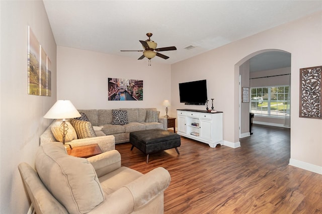 1395 Alston Bay Blvd, Apopka, FL 32703 - living room featuring arched walkways, a ceiling fan, and dark wood-style floors