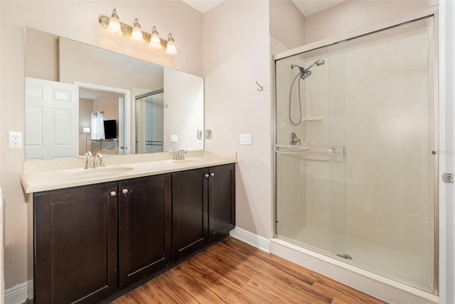 1395 Alston Bay Blvd, Apopka, FL 32703 - bathroom with a shower stall, double vanity, and wood finished floors