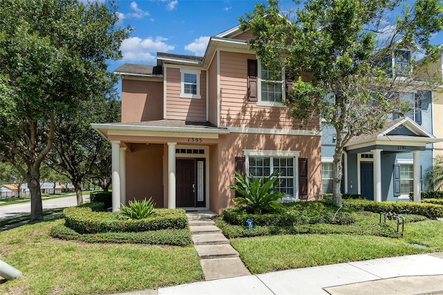 1395 Alston Bay Blvd, Apopka, FL 32703 - view of front facade featuring a front lawn, stucco siding, and a shingled roof