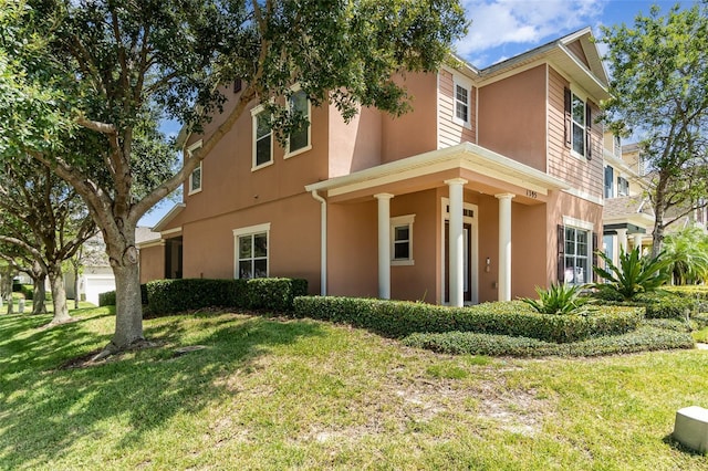 1395 Alston Bay Blvd, Apopka, FL 32703 - view of front facade with a front lawn and stucco siding