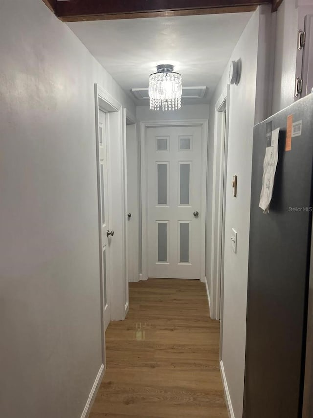 123 Rocky Rd, Lackawaxen, PA 18435 - hall with light wood-style floors and a chandelier