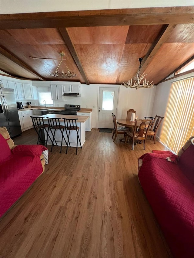 123 Rocky Rd, Lackawaxen, PA 18435 - dining room with dark wood-type flooring, a chandelier, wood ceiling, and vaulted ceiling