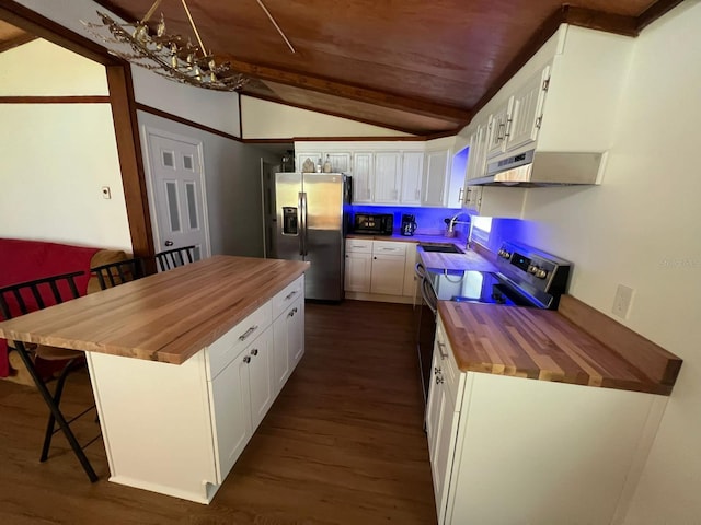 123 Rocky Rd, Lackawaxen, PA 18435 - kitchen with butcher block counters, appliances with stainless steel finishes, extractor fan, vaulted ceiling, and dark wood-style flooring