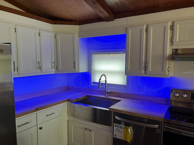 123 Rocky Rd, Lackawaxen, PA 18435 - kitchen featuring stainless steel appliances, wall chimney range hood, a wooden ceiling with exposed beams, and white cabinets