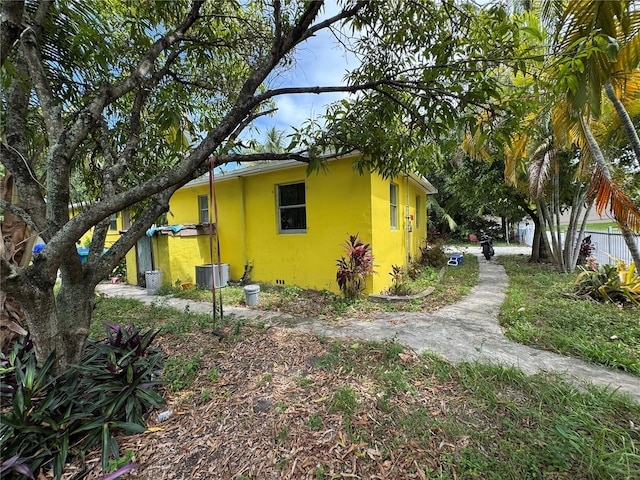 6951 NW 5th Ct, Miami, FL 33150 - view of property exterior featuring a central AC unit and stucco siding