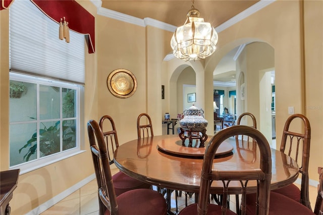 3503 92nd Ave E, Parrish, FL 34219 - dining space with arched walkways, a chandelier, light tile patterned flooring, and ornamental molding