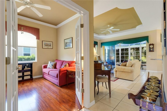 3503 92nd Ave E, Parrish, FL 34219 - living area featuring ceiling fan, ornamental molding, and light wood-style floors