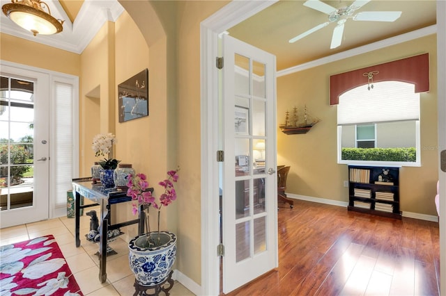 3503 92nd Ave E, Parrish, FL 34219 - foyer featuring crown molding, arched walkways, wood finished floors, and a ceiling fan