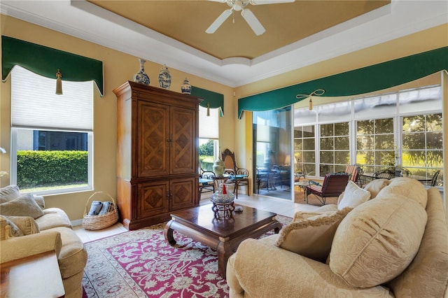 3503 92nd Ave E, Parrish, FL 34219 - living room featuring a raised ceiling, a ceiling fan, and crown molding