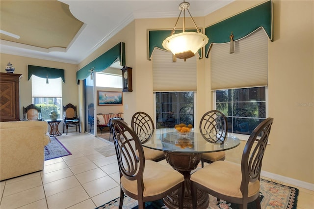 3503 92nd Ave E, Parrish, FL 34219 - dining room featuring light tile patterned floors, crown molding, and a raised ceiling