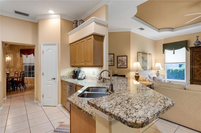 3503 92nd Ave E, Parrish, FL 34219 - kitchen featuring open floor plan, light tile patterned floors, dishwasher, a peninsula, and light stone countertops