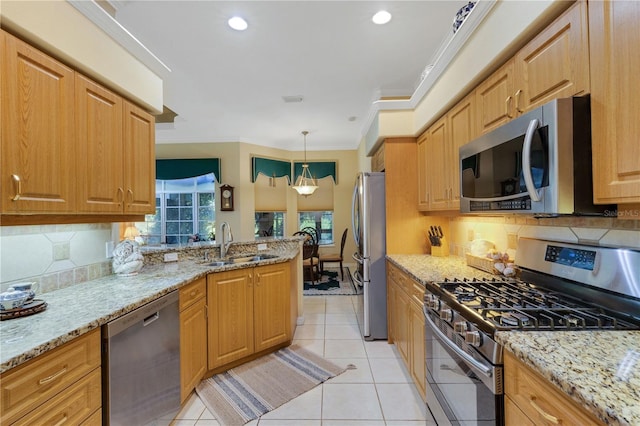 3503 92nd Ave E, Parrish, FL 34219 - kitchen featuring stainless steel appliances, ornamental molding, tasteful backsplash, light stone counters, and recessed lighting