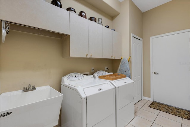 3503 92nd Ave E, Parrish, FL 34219 - laundry room featuring cabinet space, separate washer and dryer, and light tile patterned floors