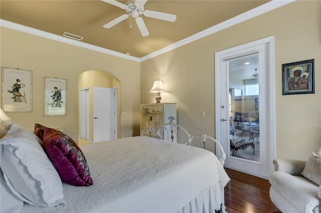 3503 92nd Ave E, Parrish, FL 34219 - bedroom with ornamental molding, arched walkways, dark wood-type flooring, and ceiling fan