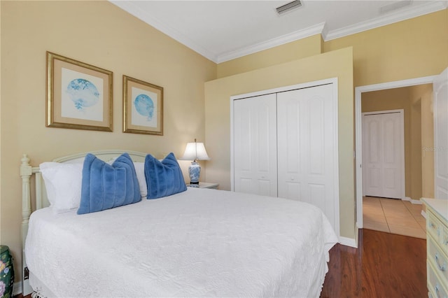 3503 92nd Ave E, Parrish, FL 34219 - bedroom with ornamental molding, a closet, and dark wood-type flooring