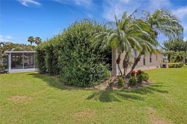 3503 92nd Ave E, Parrish, FL 34219 - view of grassy yard featuring a sunroom