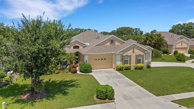 3503 92nd Ave E, Parrish, FL 34219 - view of front of property with concrete driveway, a garage, a front yard, stucco siding, and a shingled roof