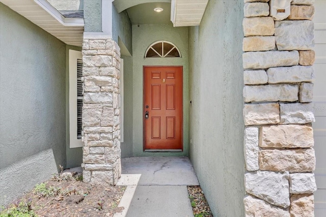 1462 Lake Shore Ranch Dr, Seffner, FL 33584 - view of exterior entry with stone siding and stucco siding