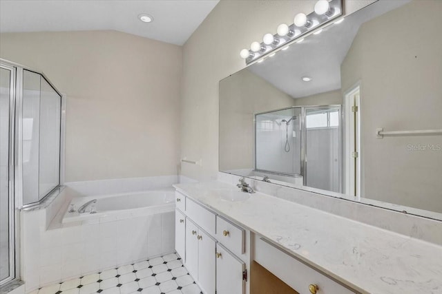 1462 Lake Shore Ranch Dr, Seffner, FL 33584 - bathroom with vanity, a shower stall, a bath, and lofted ceiling