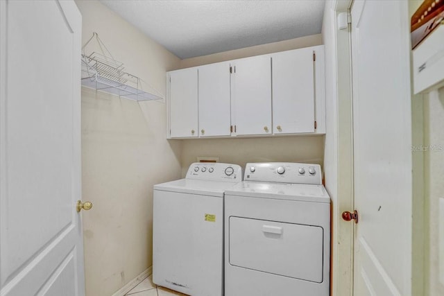 1462 Lake Shore Ranch Dr, Seffner, FL 33584 - laundry room featuring washing machine and clothes dryer, cabinet space, and a textured ceiling