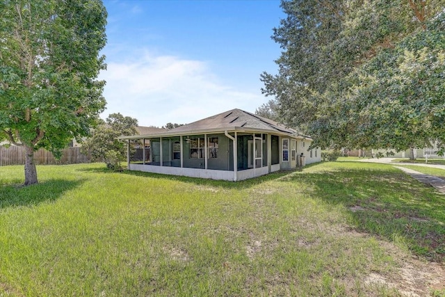 1462 Lake Shore Ranch Dr, Seffner, FL 33584 - rear view of property with a sunroom