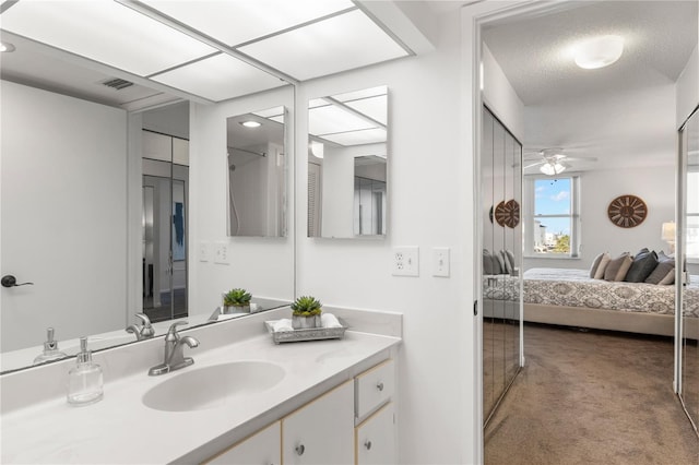 400 Island Way Unit 503, Clearwater Beach, FL 33767 - ensuite bathroom featuring vanity and a ceiling fan