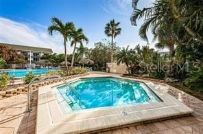 400 Island Way Unit 503, Clearwater Beach, FL 33767 - view of swimming pool with a pool, an in-ground hot tub, and a patio