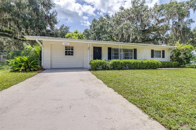 6607 S Merleing Loop, Floral City, FL 34436 - ranch-style house with driveway and brick siding