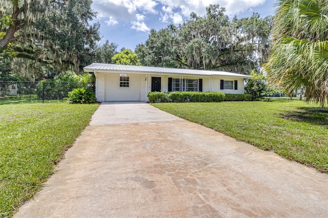6607 S Merleing Loop, Floral City, FL 34436 - ranch-style home featuring driveway and a metal roof