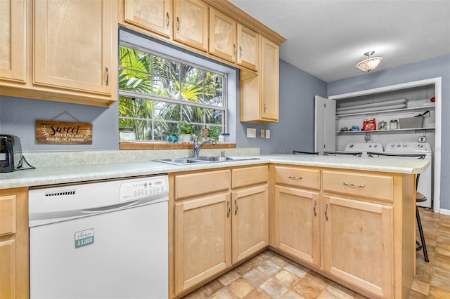 6607 S Merleing Loop, Floral City, FL 34436 - kitchen with dishwasher, light brown cabinets, a peninsula, light countertops, and stone finish flooring