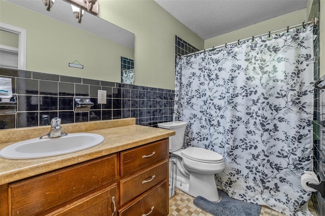 6607 S Merleing Loop, Floral City, FL 34436 - bathroom with tile walls, vanity, a textured ceiling, curtained shower, and a wainscoted wall