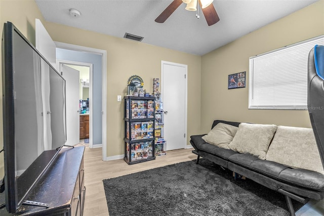 6607 S Merleing Loop, Floral City, FL 34436 - living area featuring ceiling fan and light wood-style floors