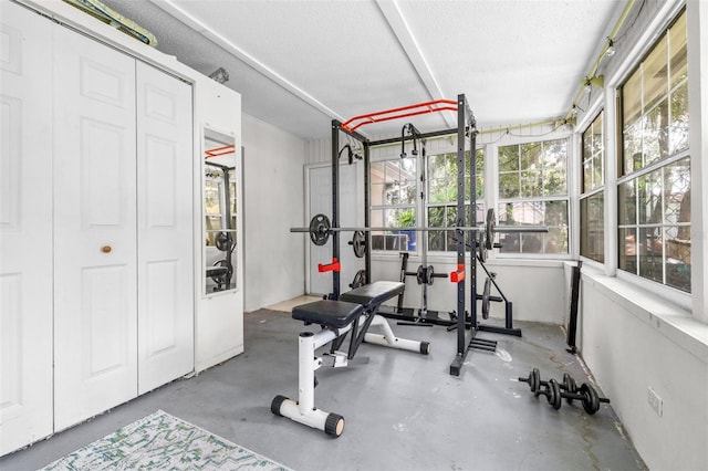 6607 S Merleing Loop, Floral City, FL 34436 - exercise area featuring a textured ceiling