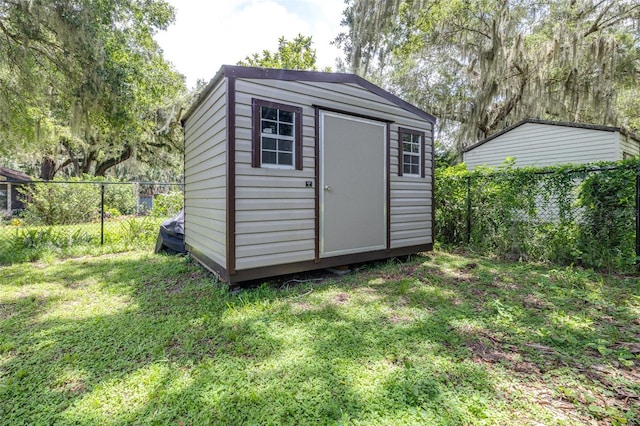 6607 S Merleing Loop, Floral City, FL 34436 - view of shed with a fenced backyard