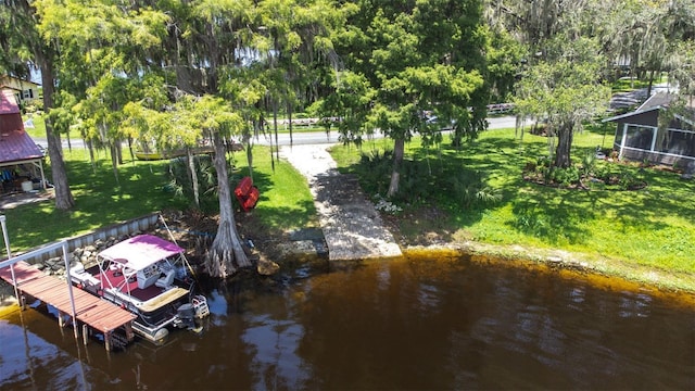 6607 S Merleing Loop, Floral City, FL 34436 - dock area with boat lift, a yard, and a water view