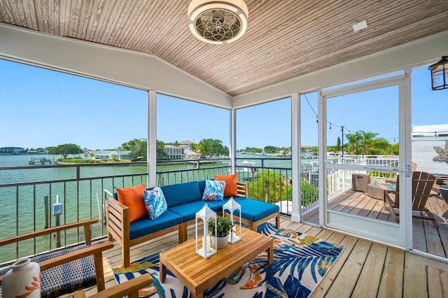 4545 Harbor Hills Dr, Largo, FL 33770 - sunroom / solarium featuring a water view, lofted ceiling, healthy amount of natural light, and outdoor lounge area