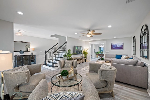 4545 Harbor Hills Dr, Largo, FL 33770 - living area featuring wood finished floors, stairway, recessed lighting, a ceiling fan, and a wainscoted wall