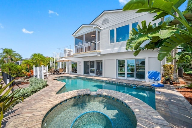 4545 Harbor Hills Dr, Largo, FL 33770 - view of swimming pool with a pool with connected hot tub, a patio area, and outdoor dining area