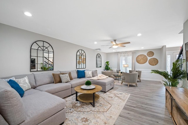 4545 Harbor Hills Dr, Largo, FL 33770 - living area featuring light wood-style flooring, recessed lighting, a ceiling fan, and wainscoting