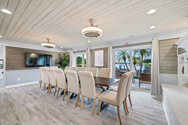 4545 Harbor Hills Dr, Largo, FL 33770 - dining area featuring wooden ceiling, light wood-style flooring, wood walls, and recessed lighting