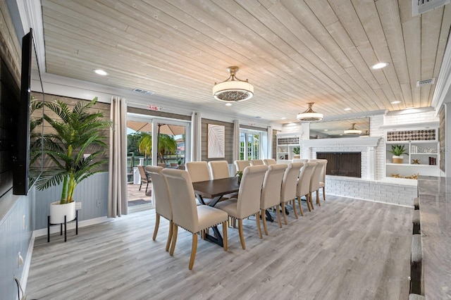 4545 Harbor Hills Dr, Largo, FL 33770 - dining area with wood ceiling, wood finished floors, recessed lighting, and a fireplace